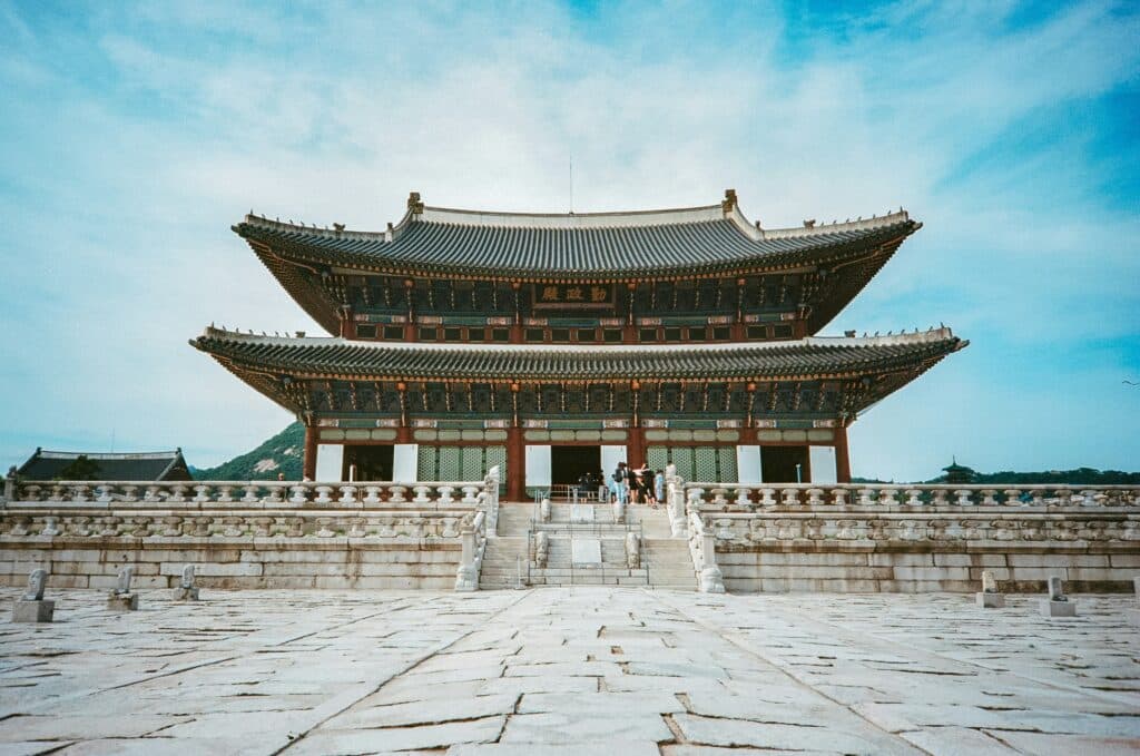 Gyeongbokgung Palace with traditional architecture and hanbok visitors in Seoul