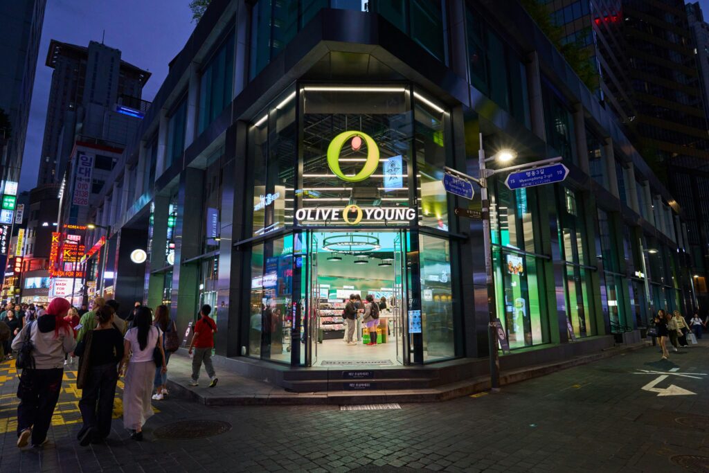 Vibrant Myeongdong street at night with neon lights and crowds in Seoul