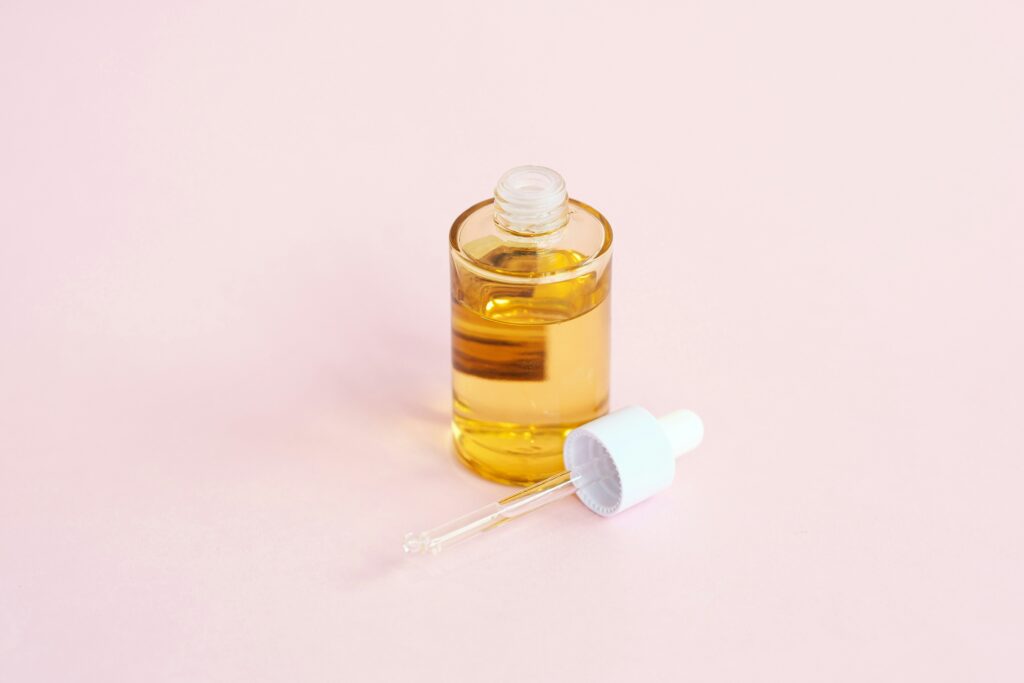Aesthetic serum dropper with Korean skincare products showing advanced texture and ingredients